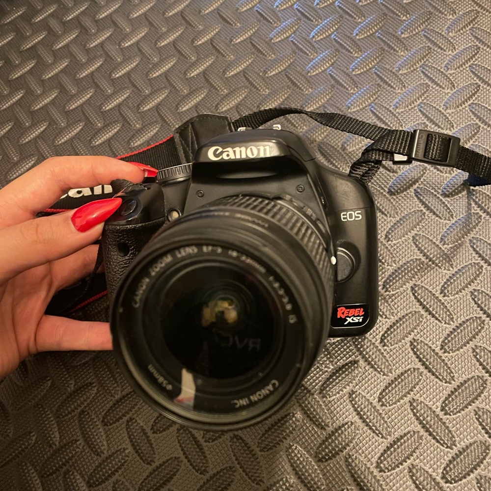 Canon Rebel EOS XSI + camera bag, battery and charger, strap.